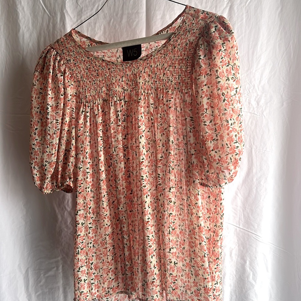 Flower-patterned flowing top.